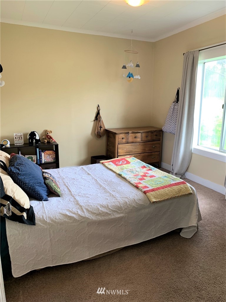 5574 E Road Bellingham, WA 98226 - Photo 14 of 25 a bedroom with a bed and window