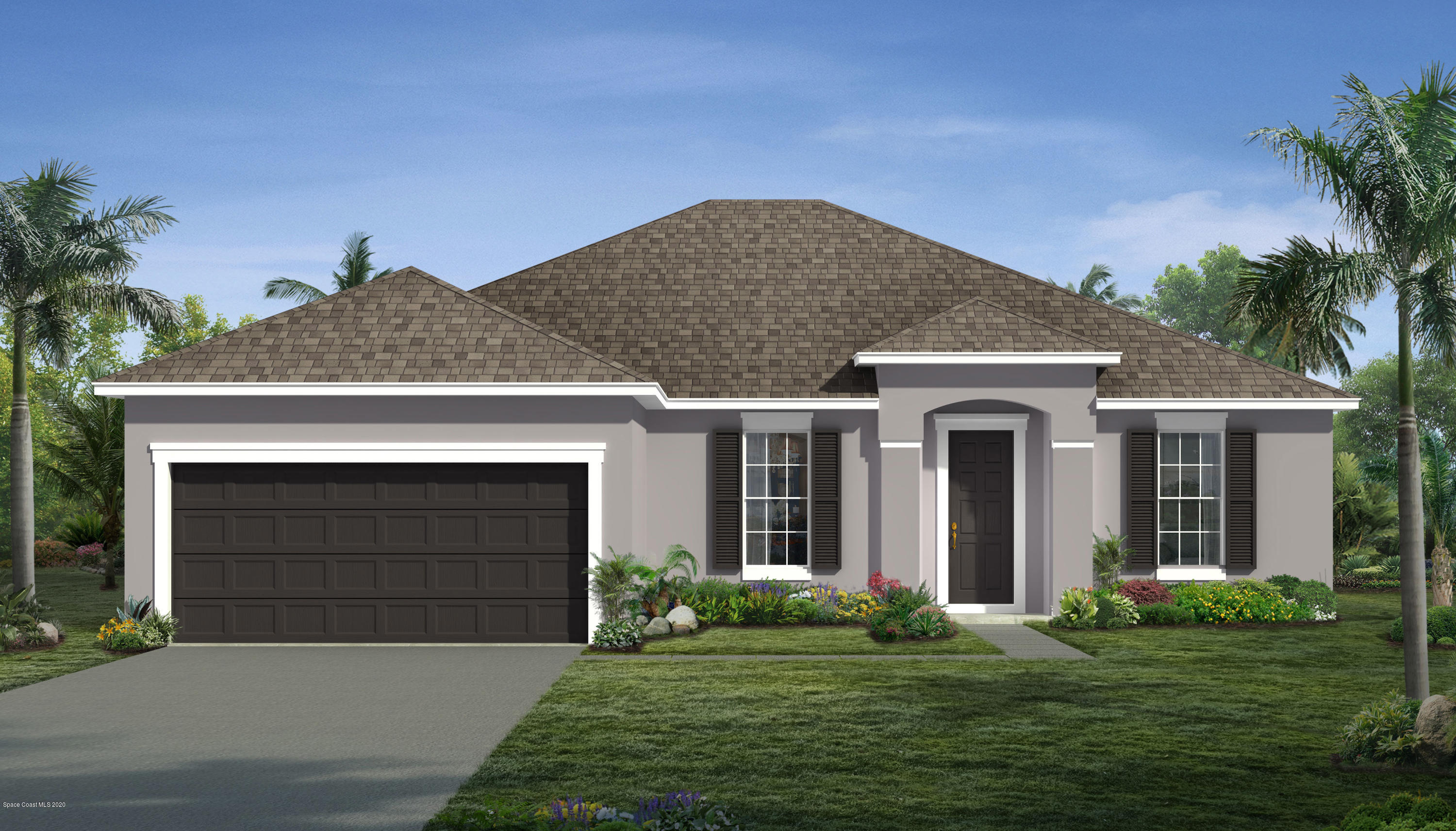 a front view of a house with a garden and yard