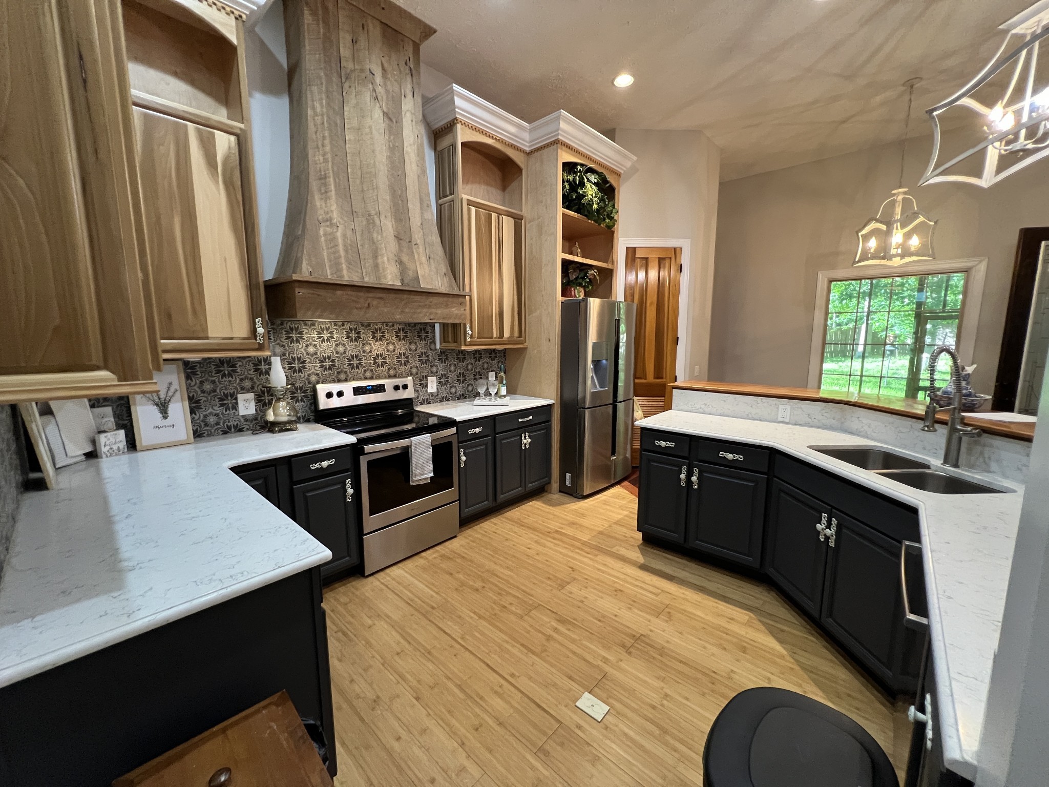 550 Laurel Crown Road Manchester, TN 37355 - Photo 25 of 87 a kitchen with stainless steel appliances granite countertop a sink a stove and a refrigerator