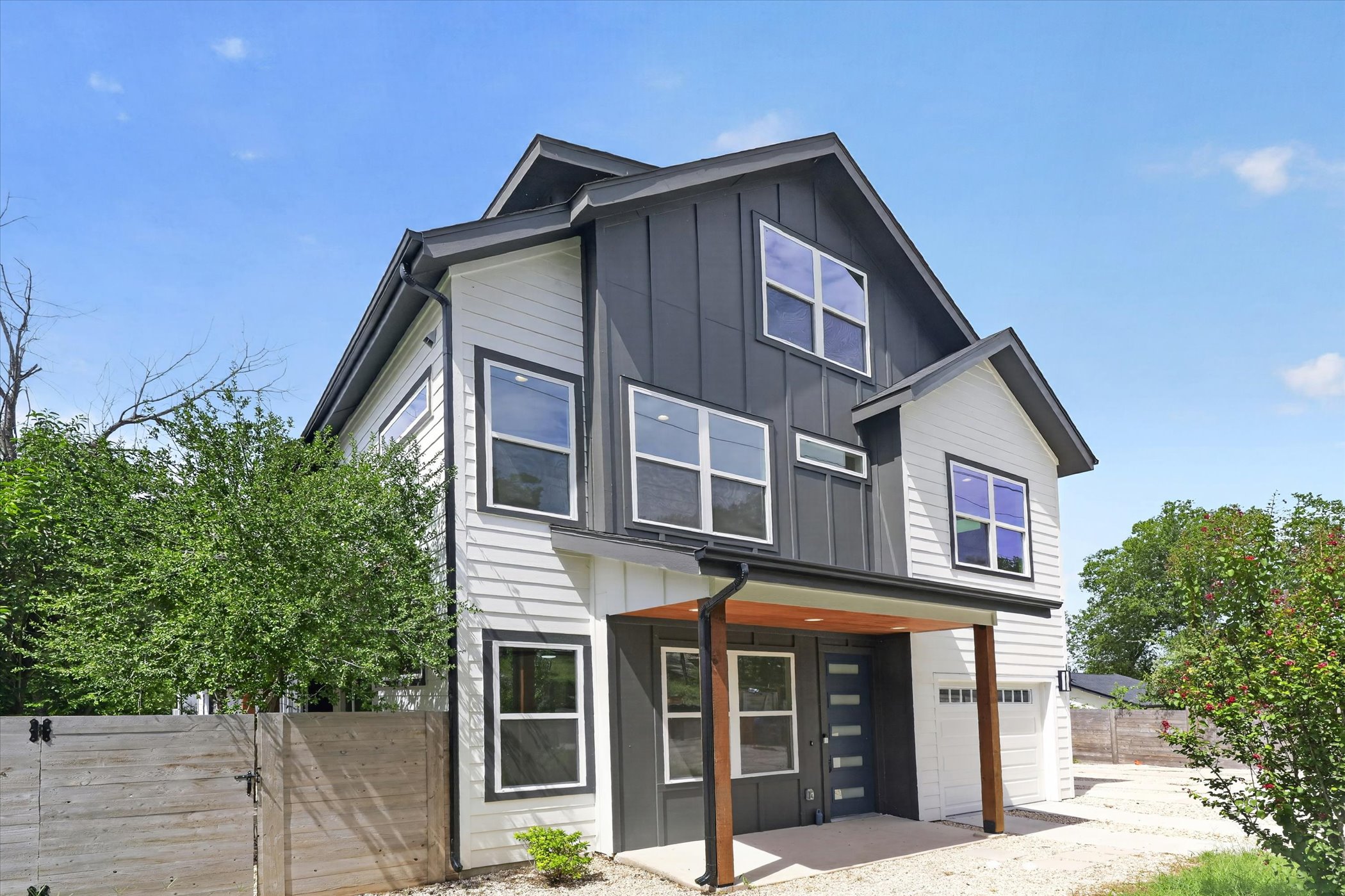 5305 Ledesma Road, Unit 1 Austin, TX 78721 - Photo 2 of 29 A striking modern residence boasts a multi-textured facade and covered entry.