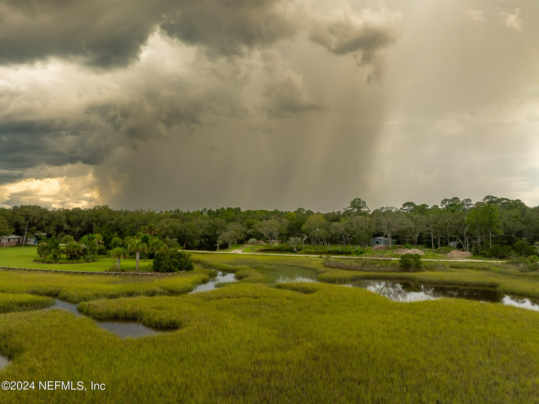 1235 Pine Island Road St. Augustine, FL 32095 - Photo 15 of 18 a view of a lake with a big yard