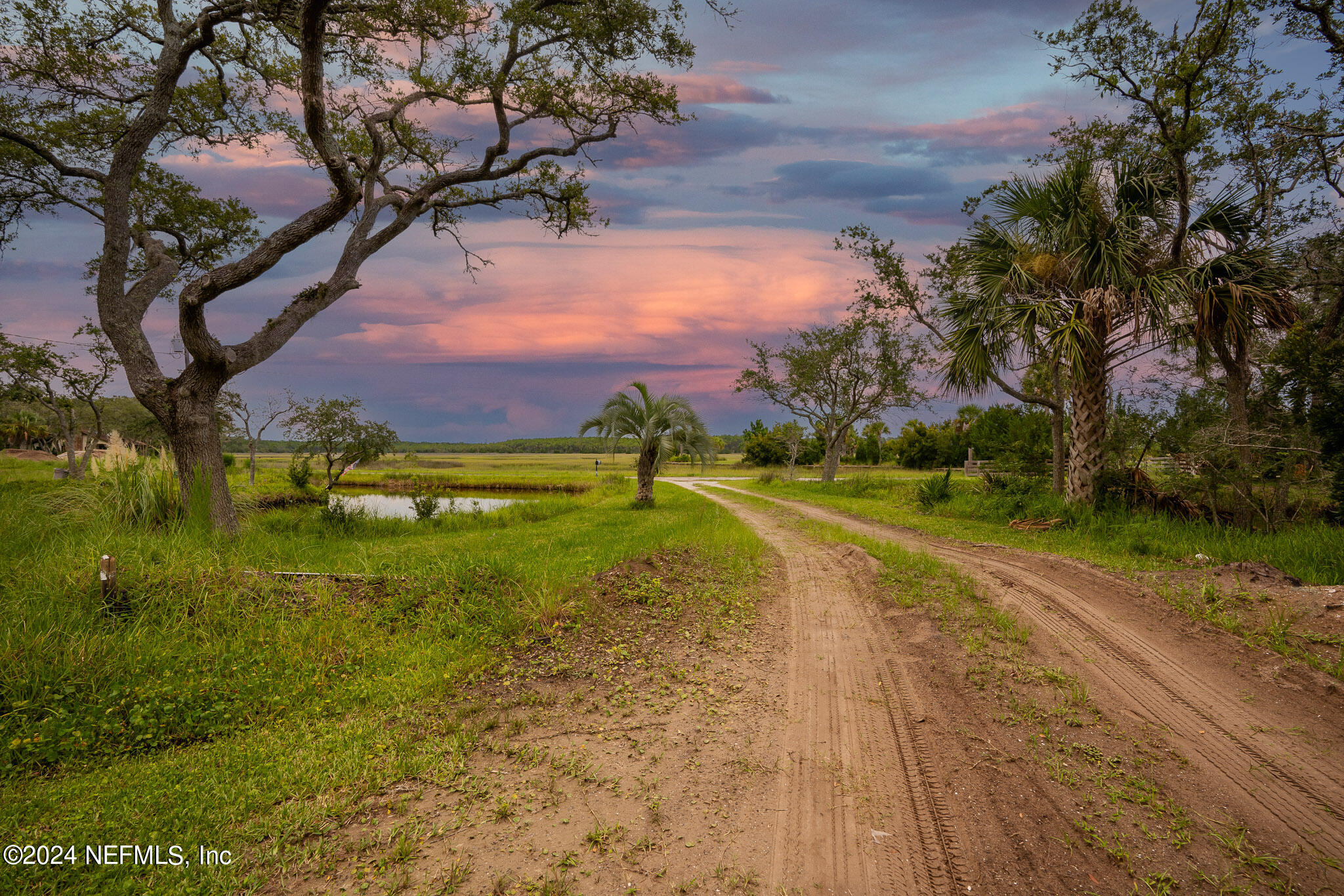 1235 Pine Island Road St. Augustine, FL 32095 - Photo 2 of 18 a view of a lake with a yard