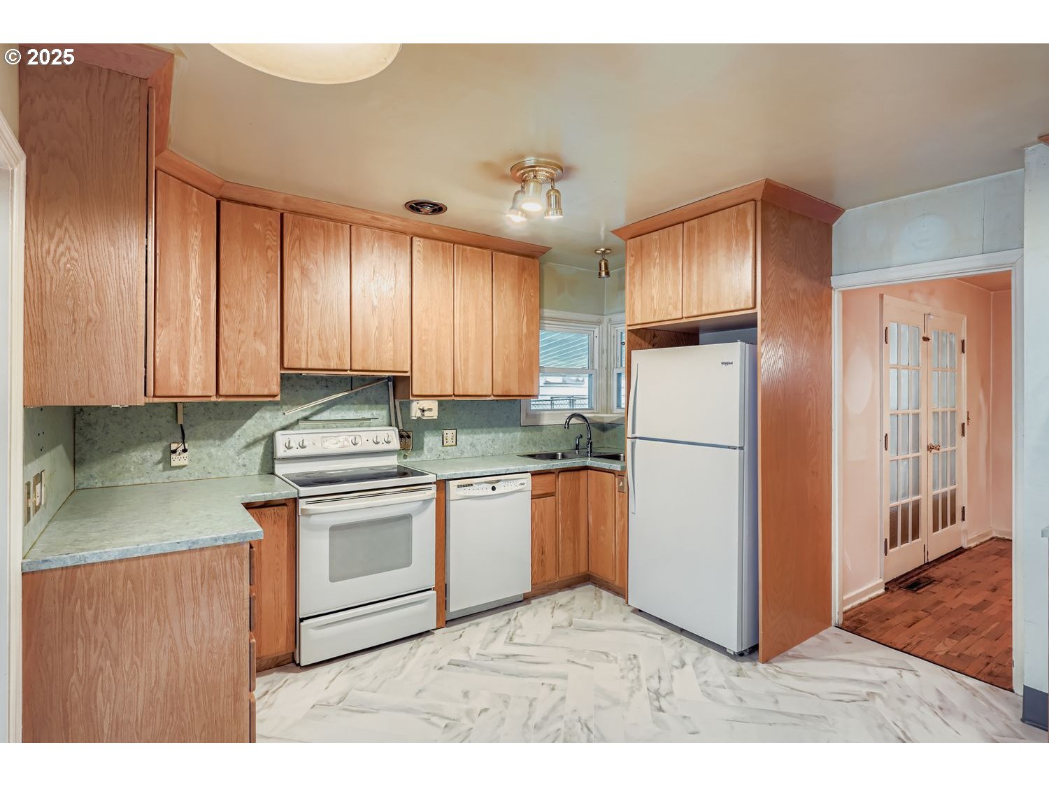 1515 Norway Street Northeast Salem, OR 97301 - Photo 11 of 27 a kitchen with stainless steel appliances granite countertop a refrigerator a sink and a stove