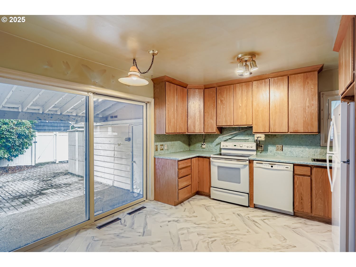 1515 Norway Street Northeast Salem, OR 97301 - Photo 10 of 27 a kitchen with stainless steel appliances granite countertop a stove a sink and a refrigerator