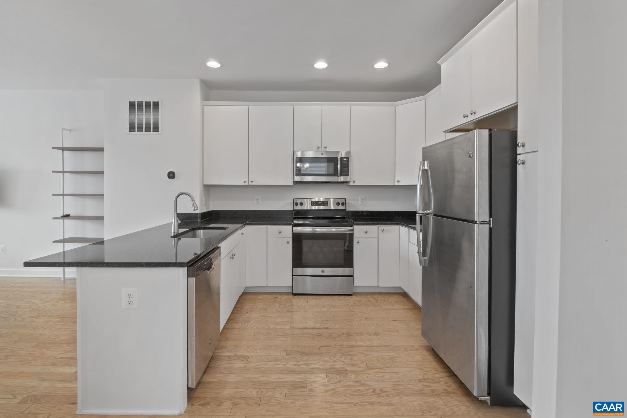 1429 Midland Street Charlottesville, VA 22902 - Photo 11 of 33 a kitchen with stainless steel appliances granite countertop a refrigerator and a stove