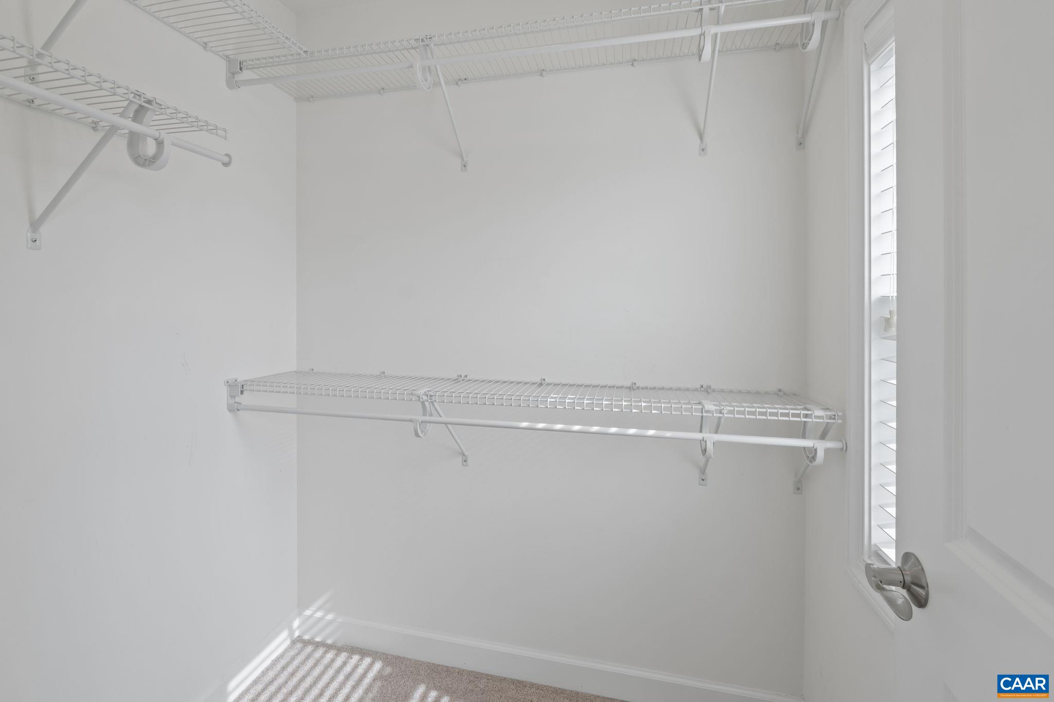 1429 Midland Street Charlottesville, VA 22902 - Photo 17 of 33 a view of a room with racks on the wall