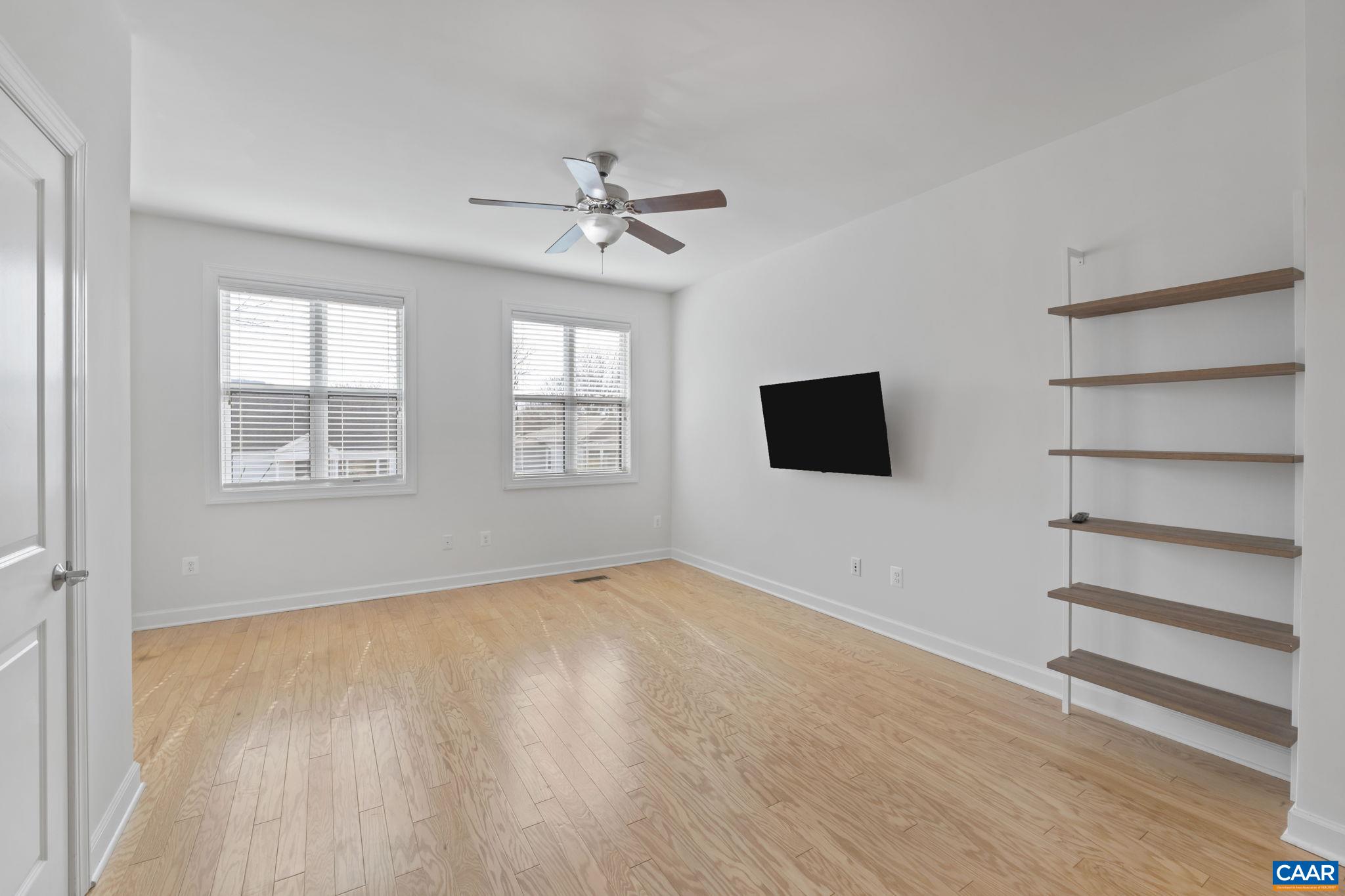 1429 Midland Street Charlottesville, VA 22902 - Photo 7 of 33 a view of an empty room with a window and wooden floor