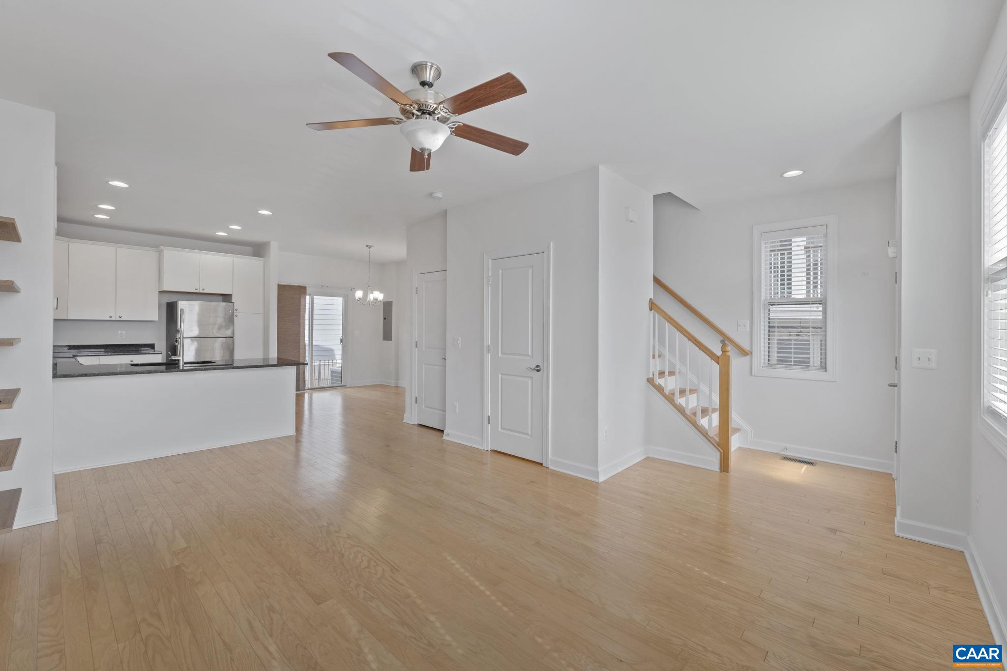 1429 Midland Street Charlottesville, VA 22902 - Photo 9 of 33 a view of a kitchen with a sink and dishwasher a refrigerator with wooden floor
