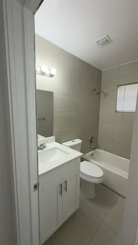 a view of a room that has a window in it