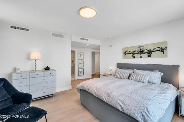 a bedroom with a bed and a table in it