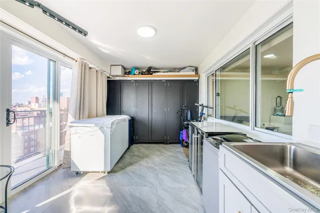 a kitchen with a sink and refrigerator