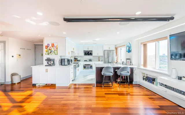 a living room with fireplace furniture and a wooden floor