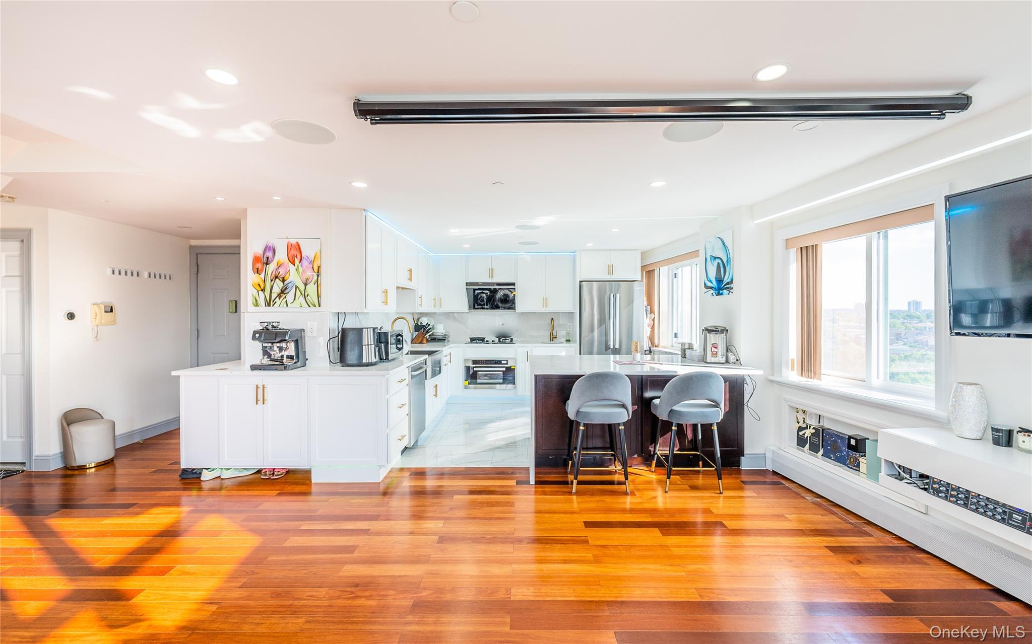43-18 Main Street, Unit 12A Queens, NY 11355 - Photo 15 of 32 a living room with fireplace furniture and a wooden floor