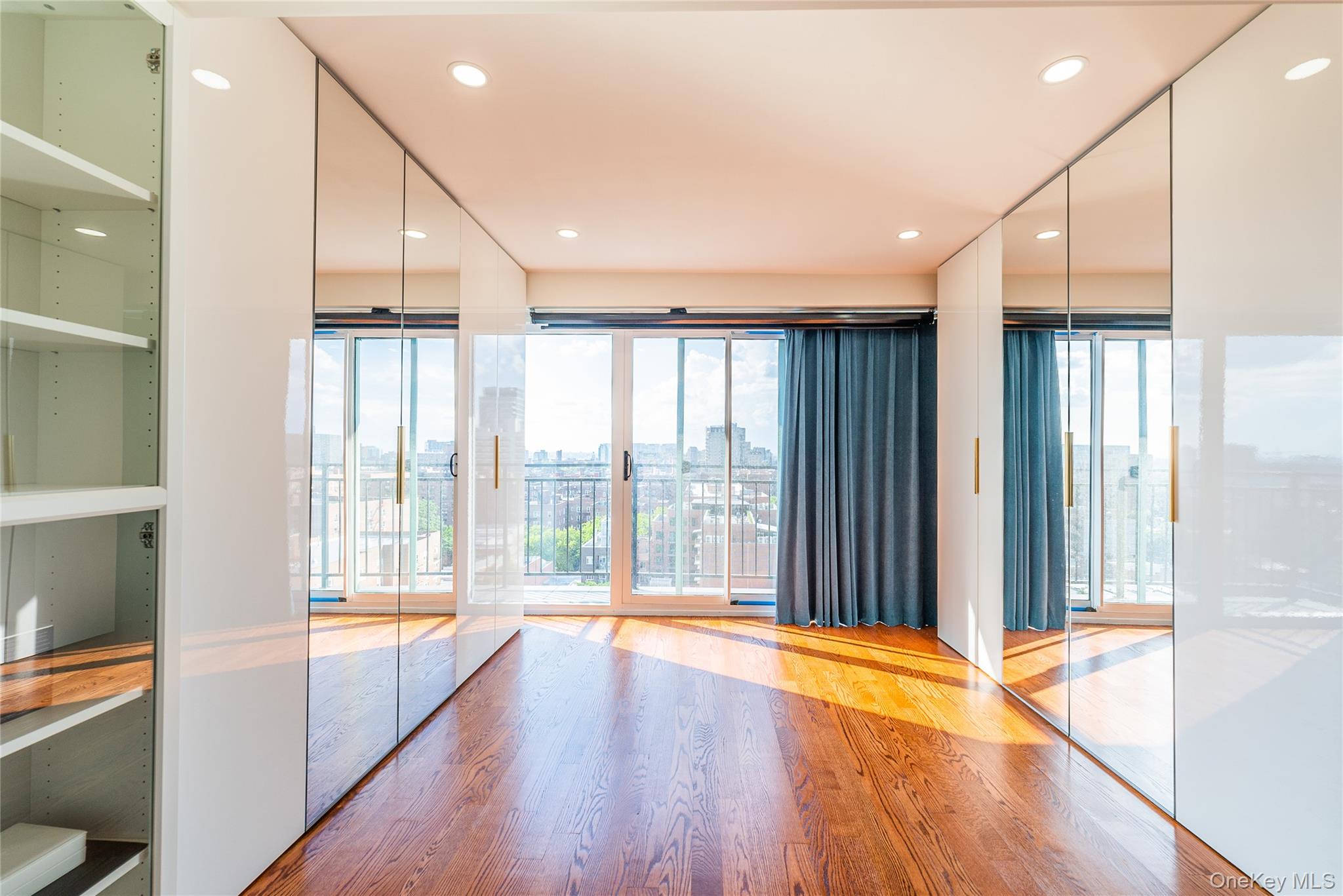 43-18 Main Street, Unit 12A Queens, NY 11355 - Photo 24 of 32 a view of an empty room with wooden floor and a window