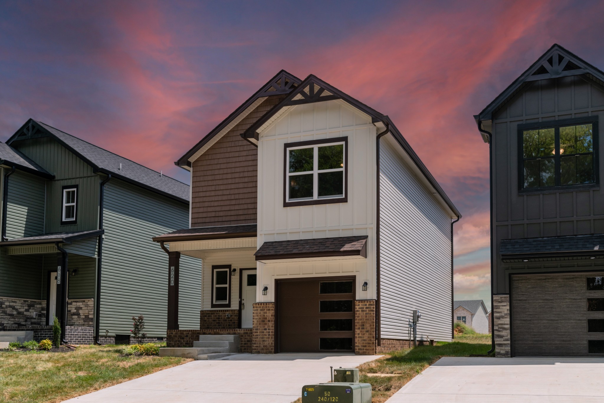 a front view of a house with a yard