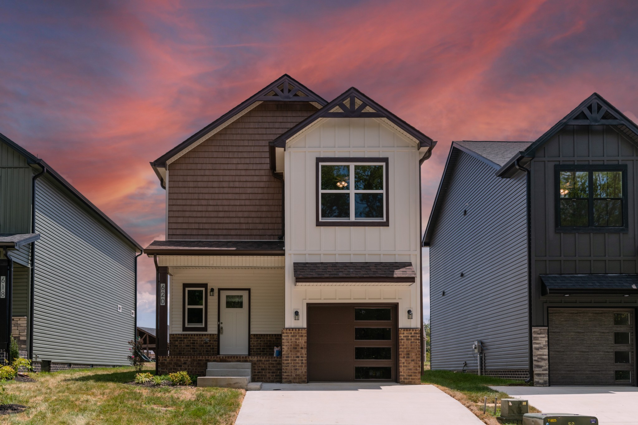 a front view of a house with yard
