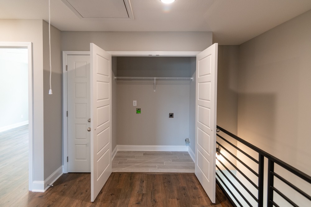 620 Southern Pass Run Clarksville, TN 37043 - Photo 15 of 22 a view of a hallway with wooden floor and staircase