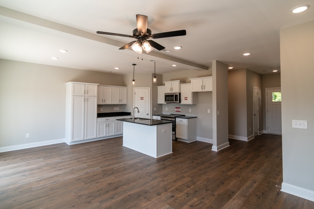 620 Southern Pass Run Clarksville, TN 37043 - Photo 10 of 22 a kitchen with kitchen island white cabinets and stainless steel appliances