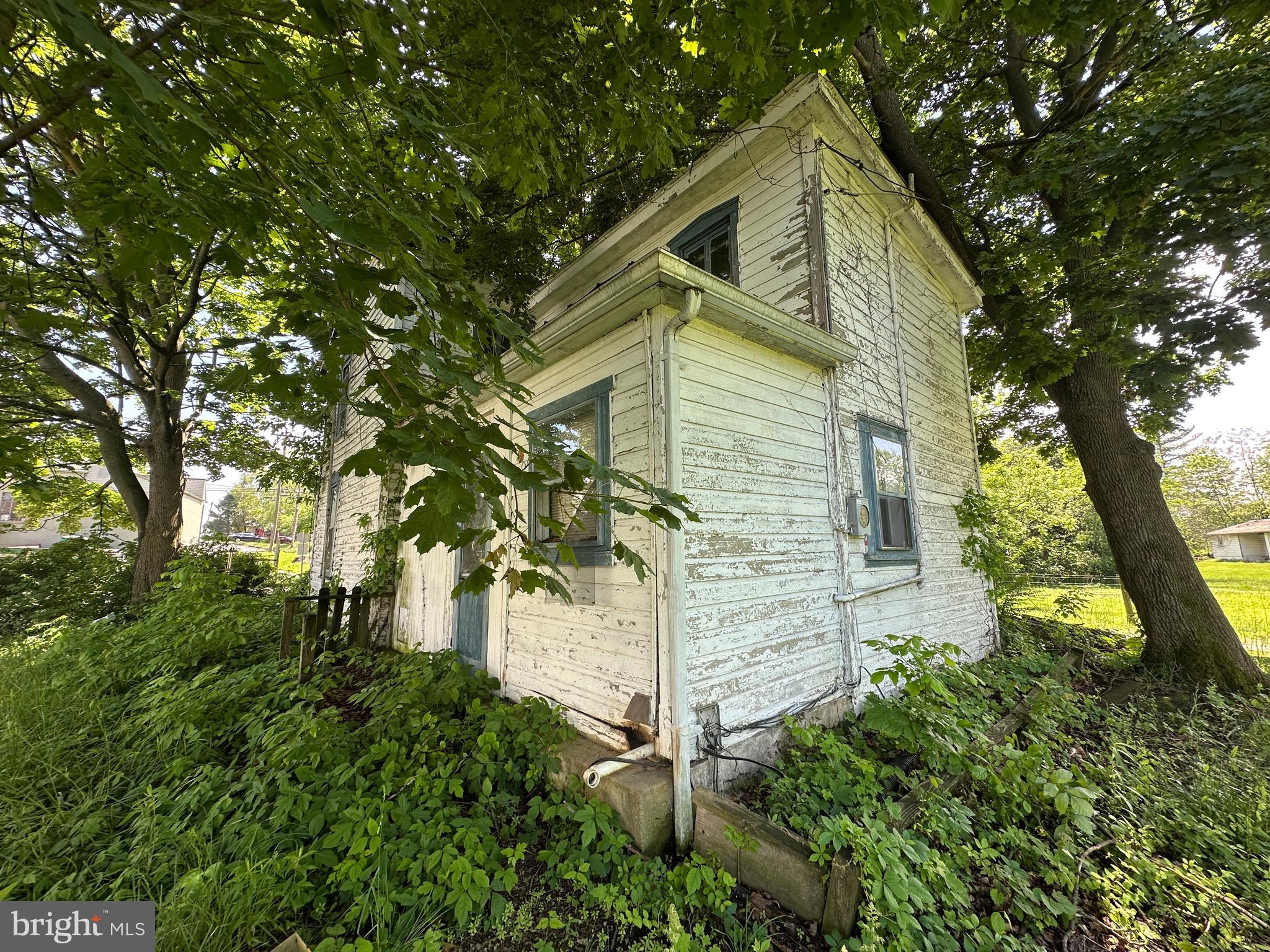 12007 White Hall Road Chewsville, MD 21783 - Photo 13 of 42 a view of a wooden house with a tree