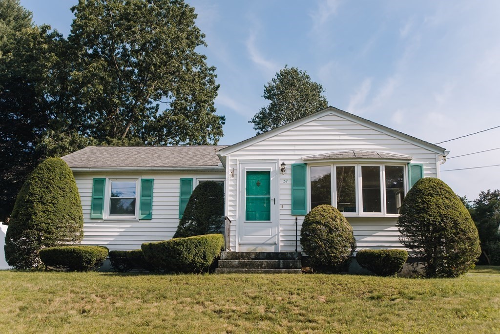 37 Timothy Circle Springfield, MA 01119 - Photo 1 of 37 a front view of a house with a garden