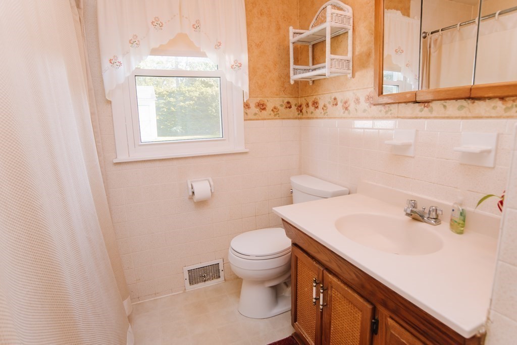 37 Timothy Circle Springfield, MA 01119 - Photo 22 of 37 a bathroom with a sink a toilet and a window