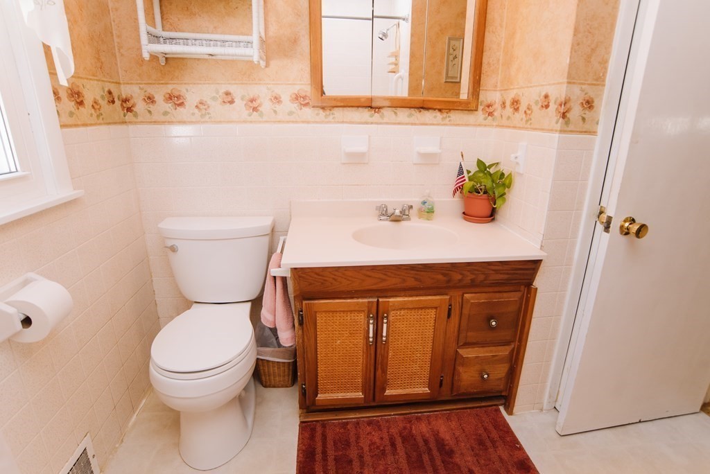 37 Timothy Circle Springfield, MA 01119 - Photo 23 of 37 a bathroom with a sink a toilet and a mirror