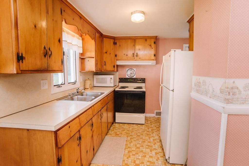 37 Timothy Circle Springfield, MA 01119 - Photo 9 of 37 a kitchen with stainless steel appliances granite countertop a refrigerator a sink and a stove