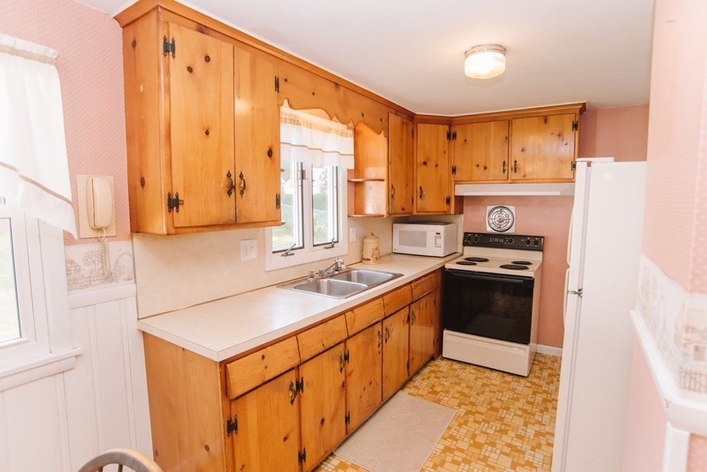 37 Timothy Circle Springfield, MA 01119 - Photo 10 of 37 a kitchen with stainless steel appliances a sink cabinets and a window