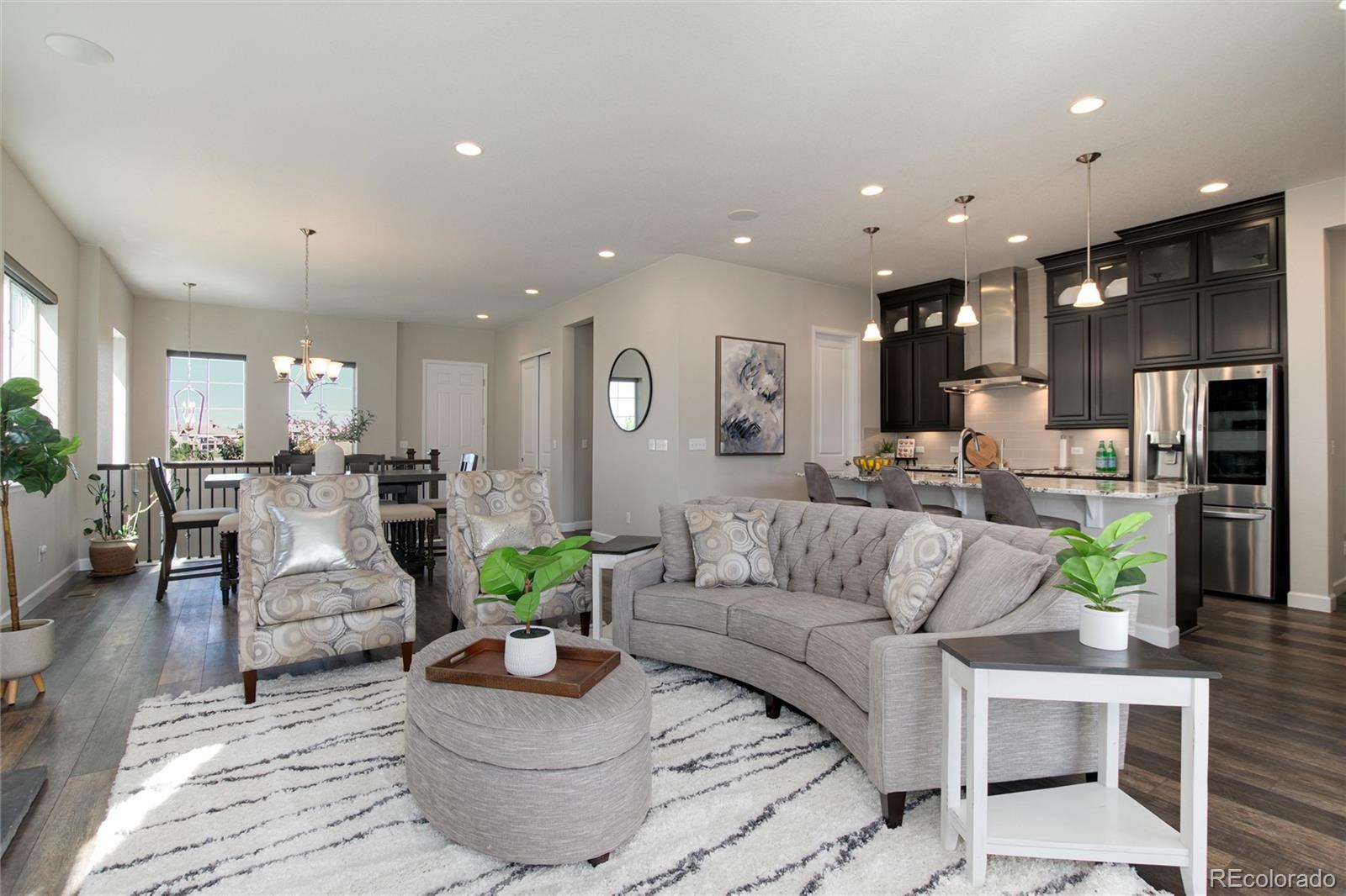 1165 Brocade Drive Highlands Ranch, CO 80126 - Photo 11 of 40 a living room with furniture kitchen view and a table