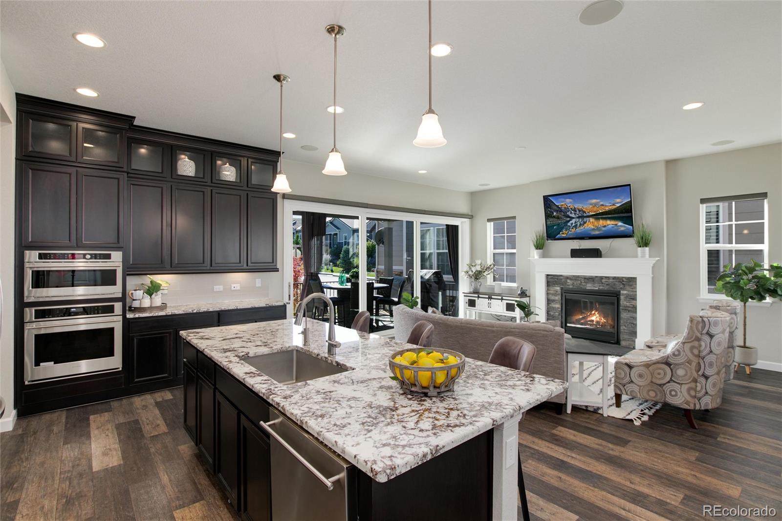 1165 Brocade Drive Highlands Ranch, CO 80126 - Photo 17 of 40 a kitchen with a stove and a refrigerator