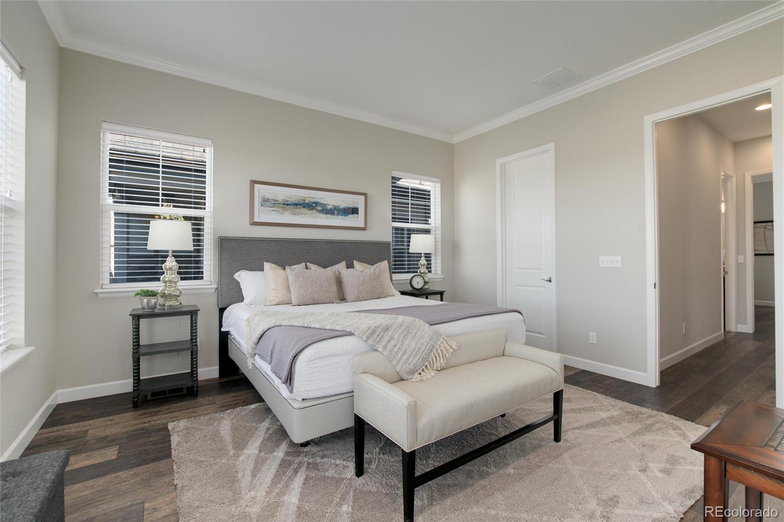 1165 Brocade Drive Highlands Ranch, CO 80126 - Photo 24 of 40 a spacious bedroom with a bed and a window