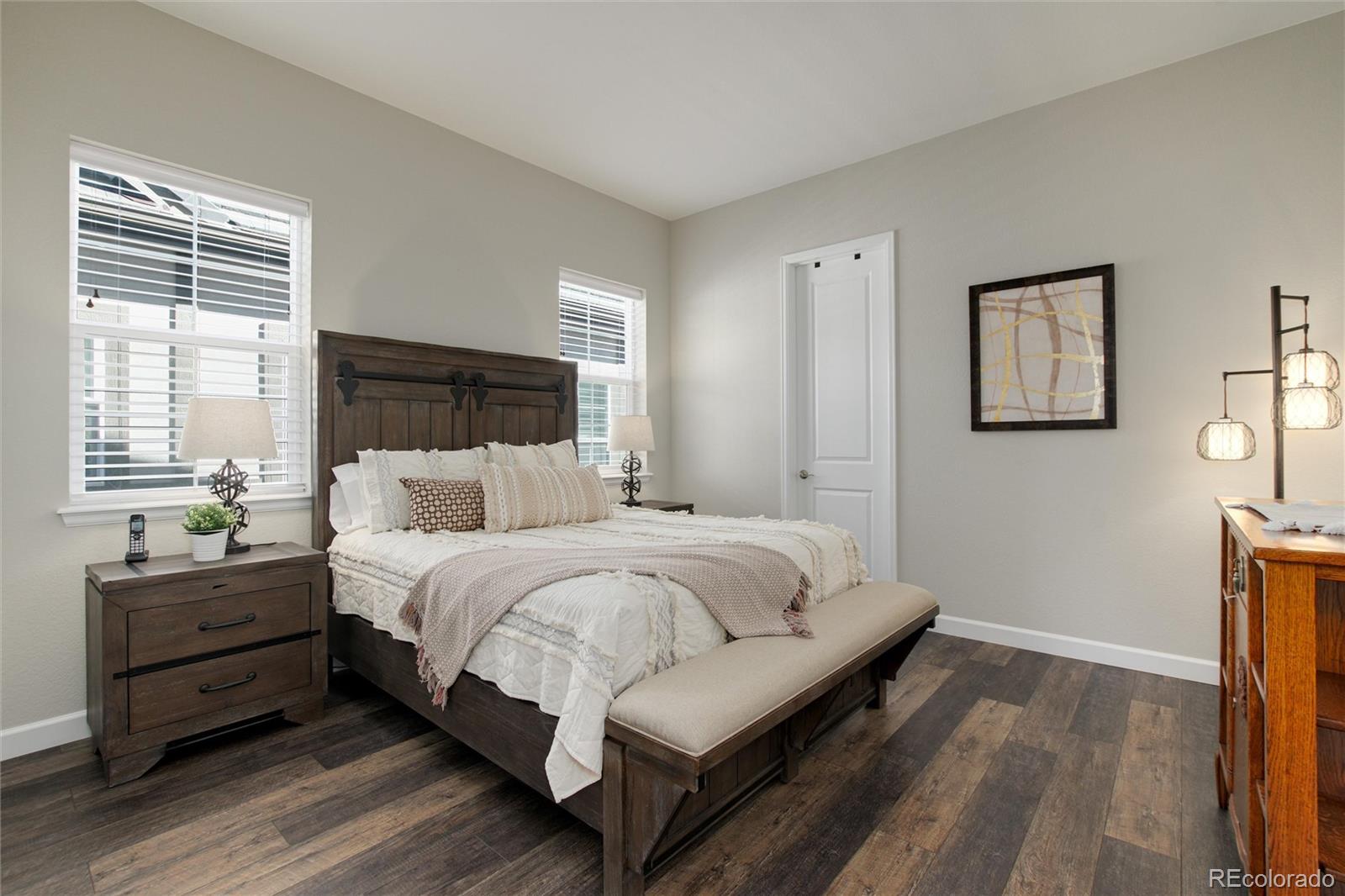 1165 Brocade Drive Highlands Ranch, CO 80126 - Photo 27 of 40 a bedroom with bed and window