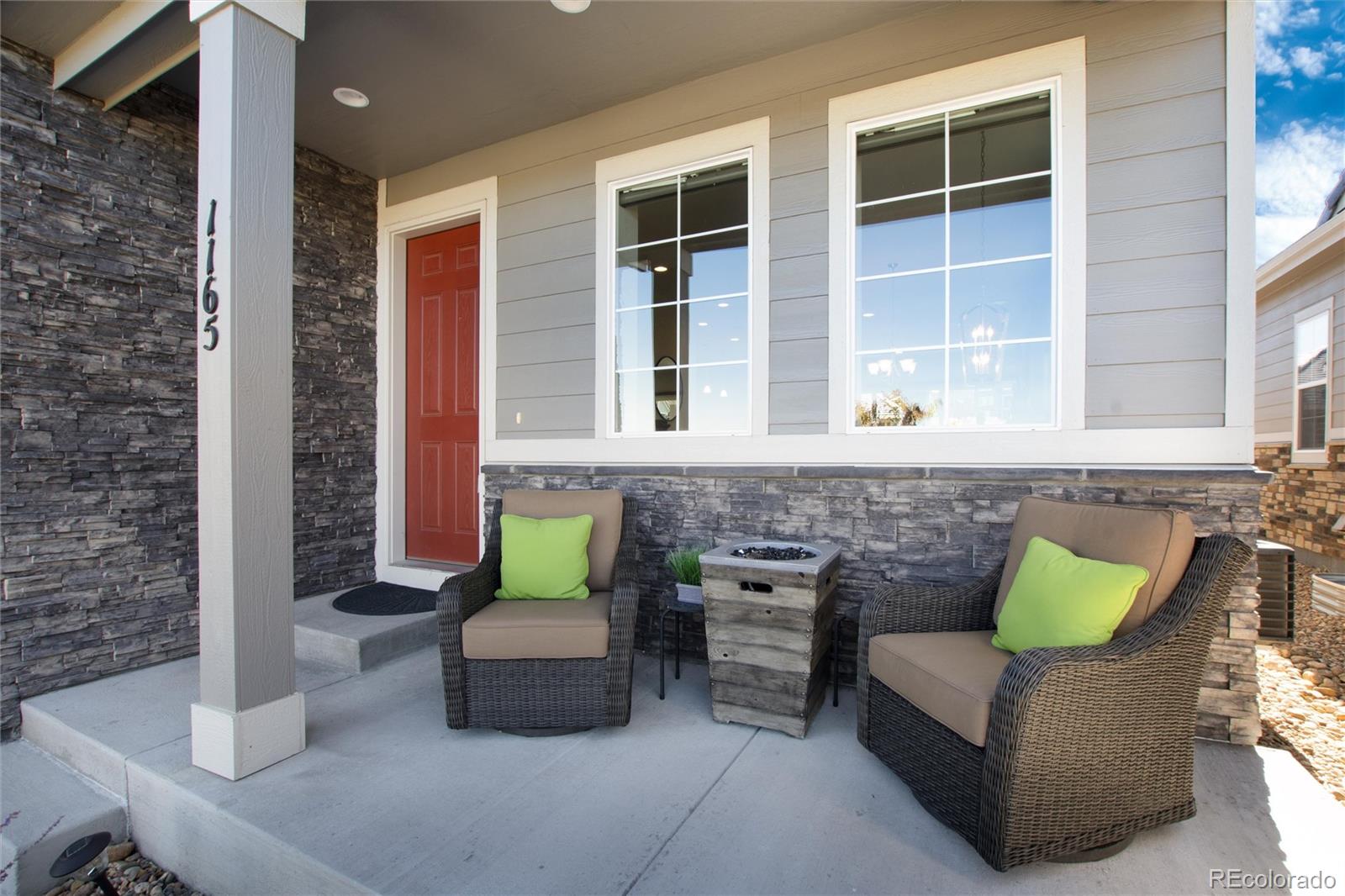 1165 Brocade Drive Highlands Ranch, CO 80126 - Photo 3 of 40 a outdoor living space with patio furniture