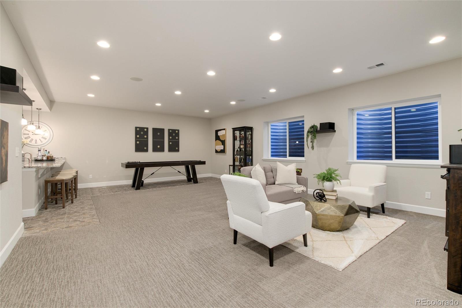 1165 Brocade Drive Highlands Ranch, CO 80126 - Photo 32 of 40 a living room with furniture and a table