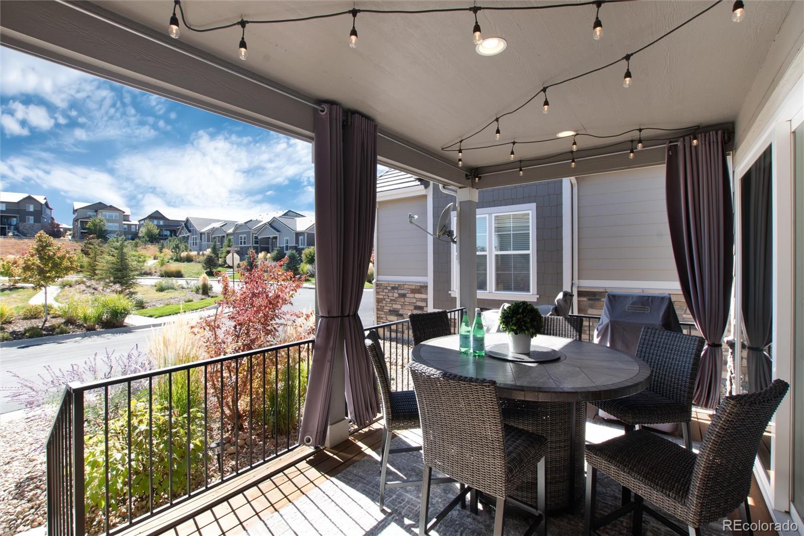 1165 Brocade Drive Highlands Ranch, CO 80126 - Photo 37 of 40 a view of a balcony dining table and chairs