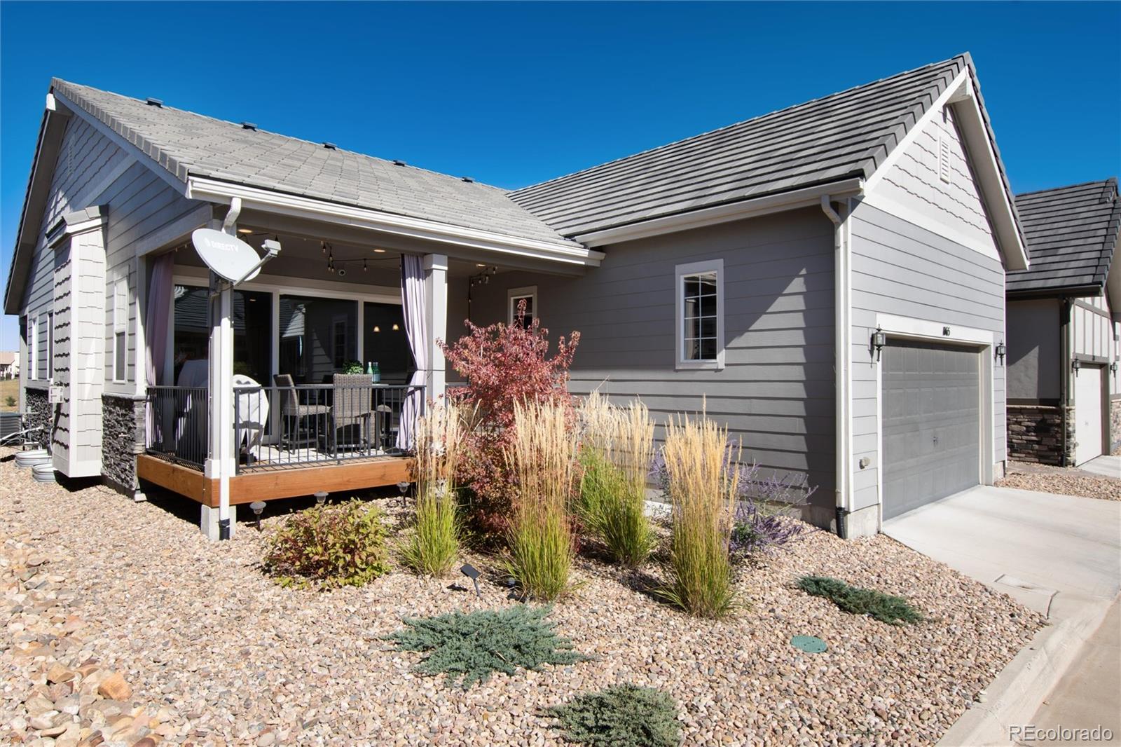 1165 Brocade Drive Highlands Ranch, CO 80126 - Photo 39 of 40 front view of a house with a porch