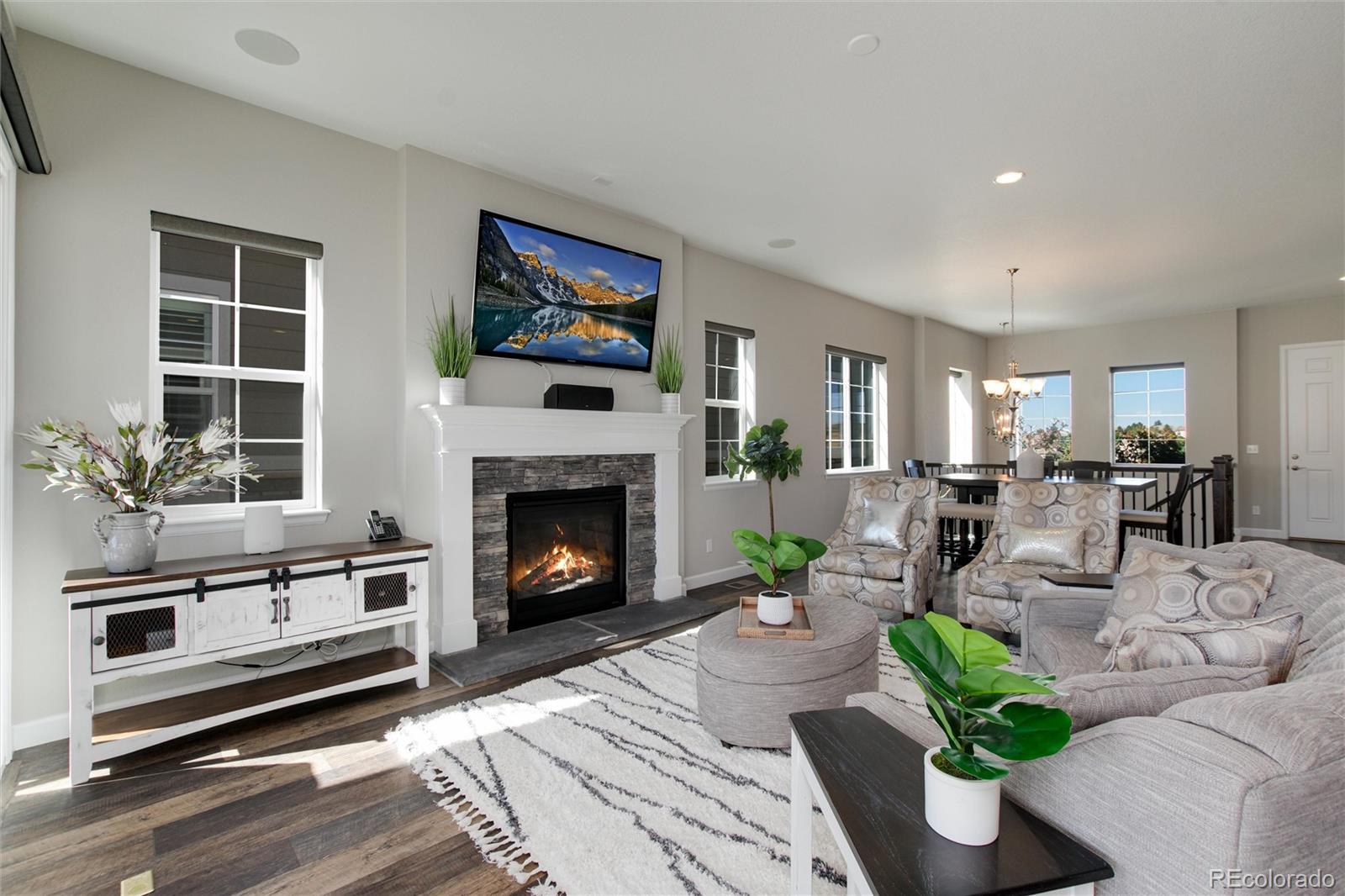 1165 Brocade Drive Highlands Ranch, CO 80126 - Photo 10 of 40 a living room with furniture and a fireplace