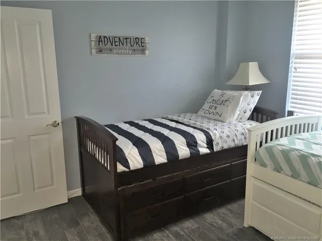 a bedroom with bed and window