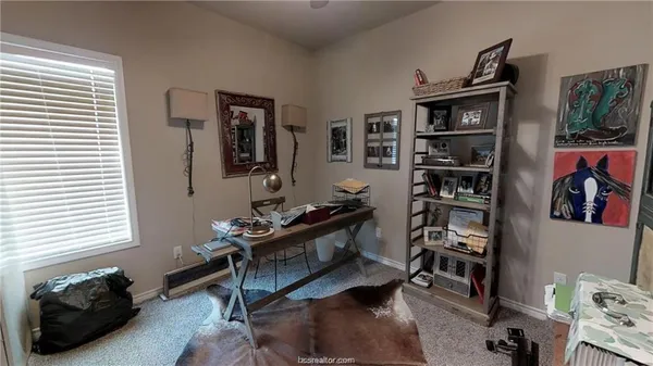 a room with furniture workspace and a window