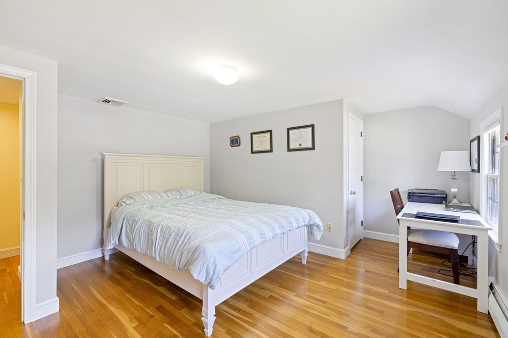 3 Hadley Road Lexington, MA 02420 - Photo 20 of 30 a bedroom with a bed and a desk