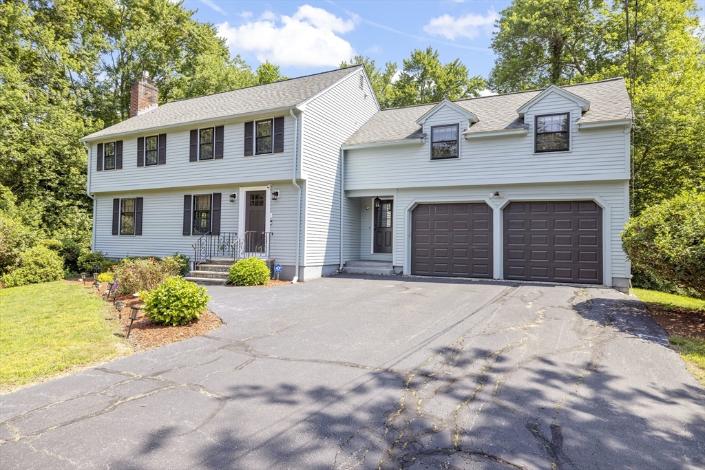 3 Hadley Road Lexington, MA 02420 - Photo 2 of 30 a front view of a house with garden