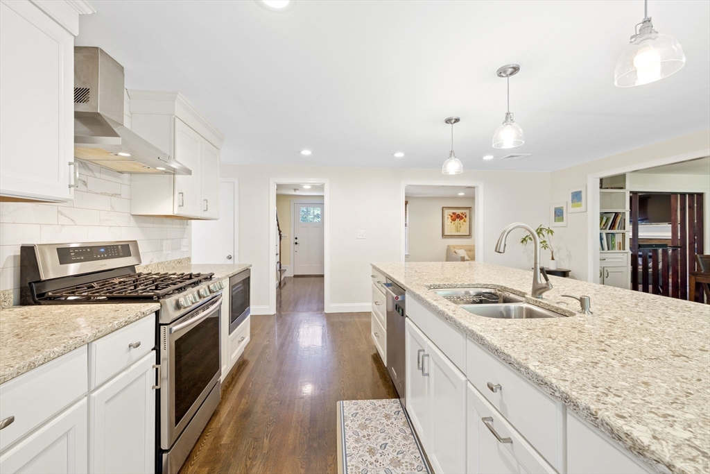 3 Hadley Road Lexington, MA 02420 - Photo 5 of 30 a kitchen with granite countertop a sink stove and refrigerator