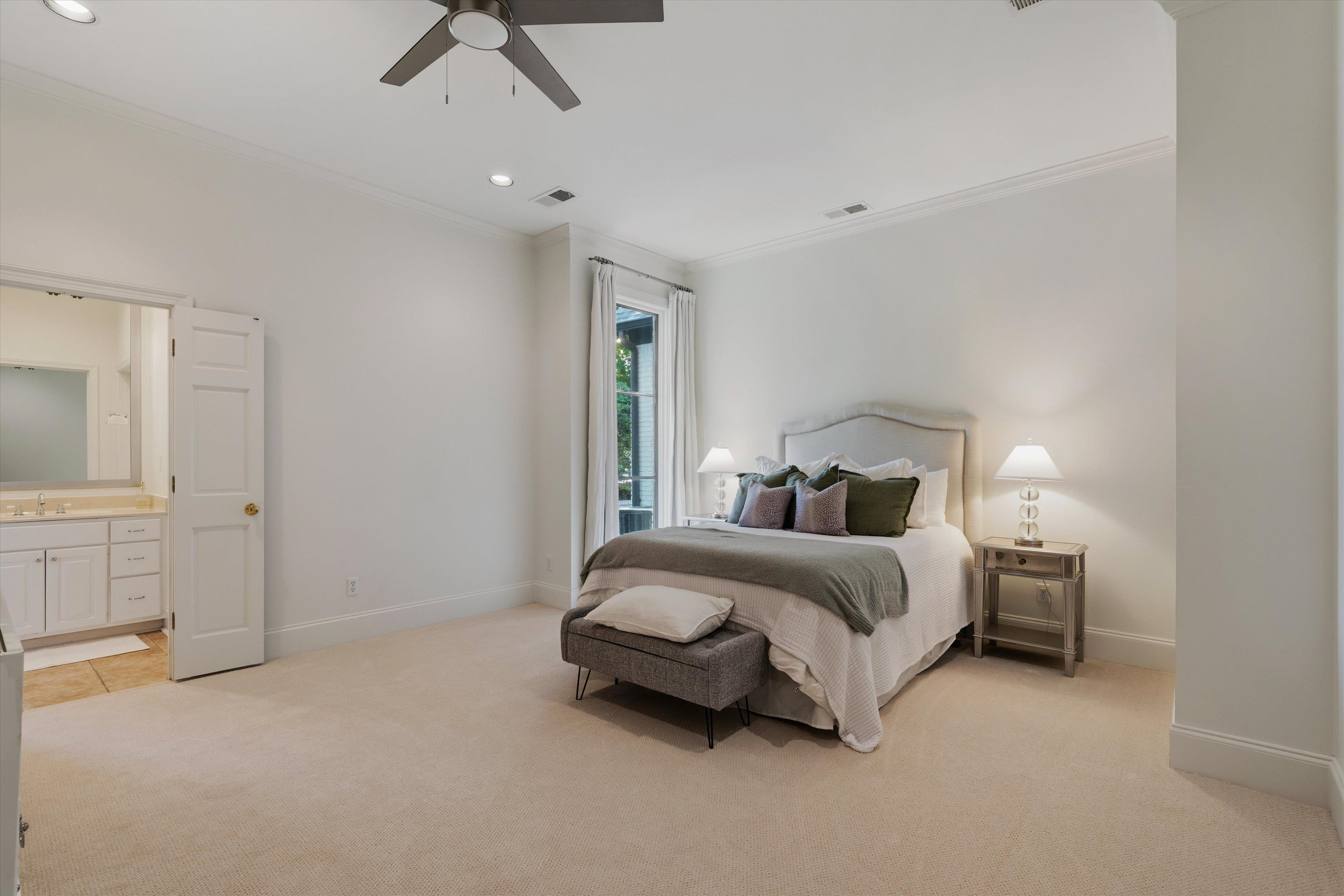 4710 Gwynne Road Memphis, TN 38117 - Photo 29 of 40 a spacious bedroom with a bed and cabinet