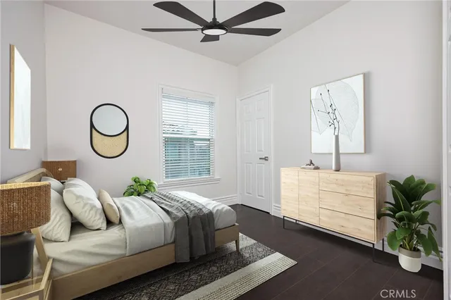 a bedroom with bed and a window