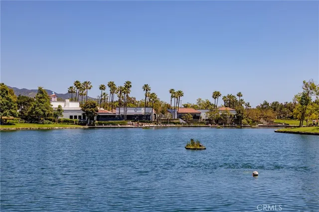 an aerial view of a house with a lake view