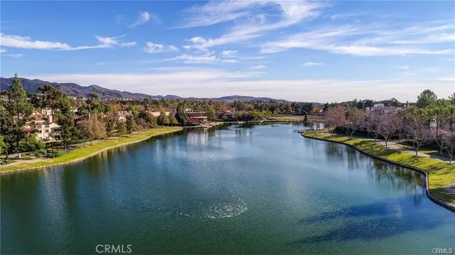 an aerial view of a house with yard swimming pool and outdoor seating