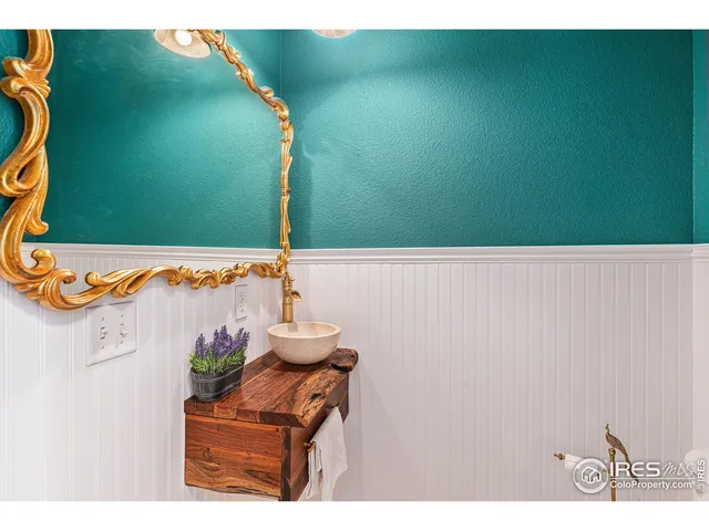 a kitchen with a stove and a white cabinet