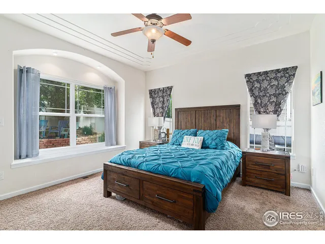 a bed room with a bed and a window