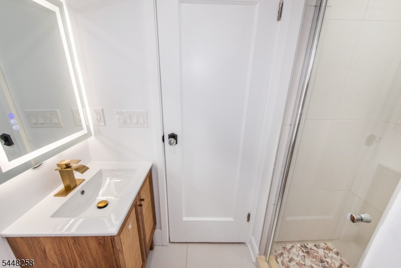 570 Cameron Road South Orange, NJ 07079 - Photo 24 of 32 a bathroom with a sink a tub and a window