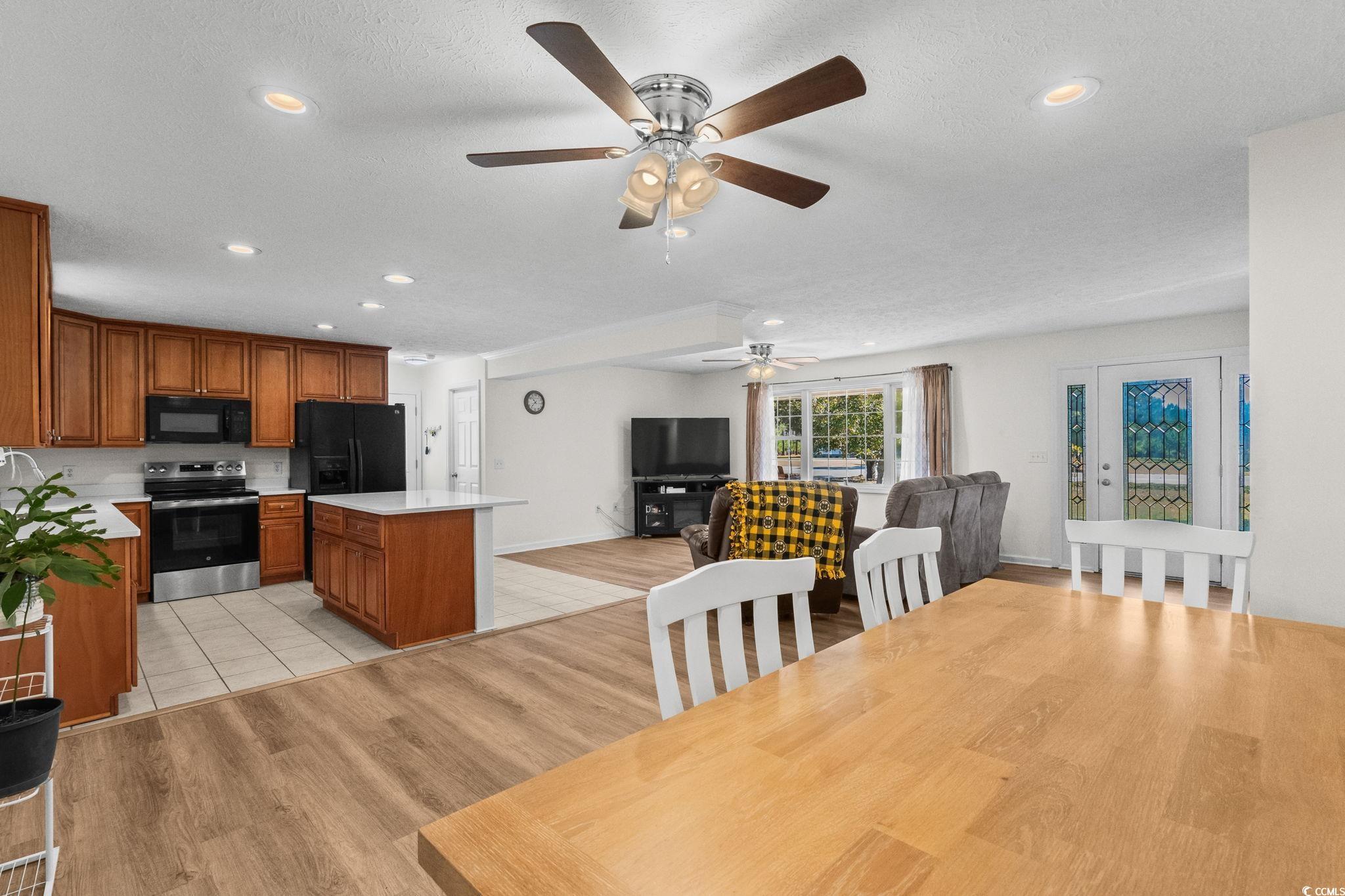 1996 Heritage Road Loris, SC 29569 - Photo 15 of 40 Dining area with light wood-style flooring, recessed lighting, and a textured ceiling